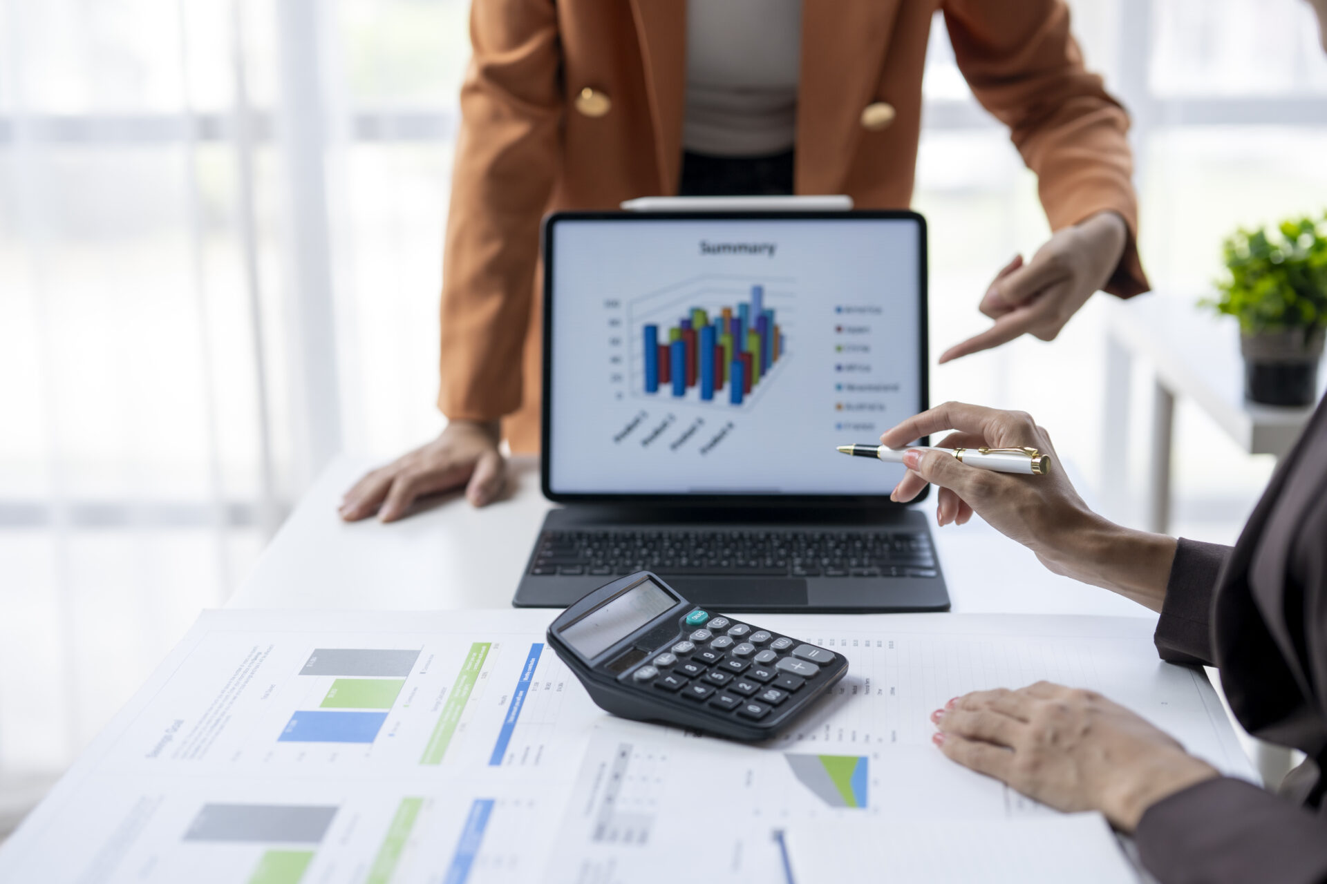 business-team-analyzing-financial-charts-and-graph-lucia-co-cpas-inc-cloud-accounting