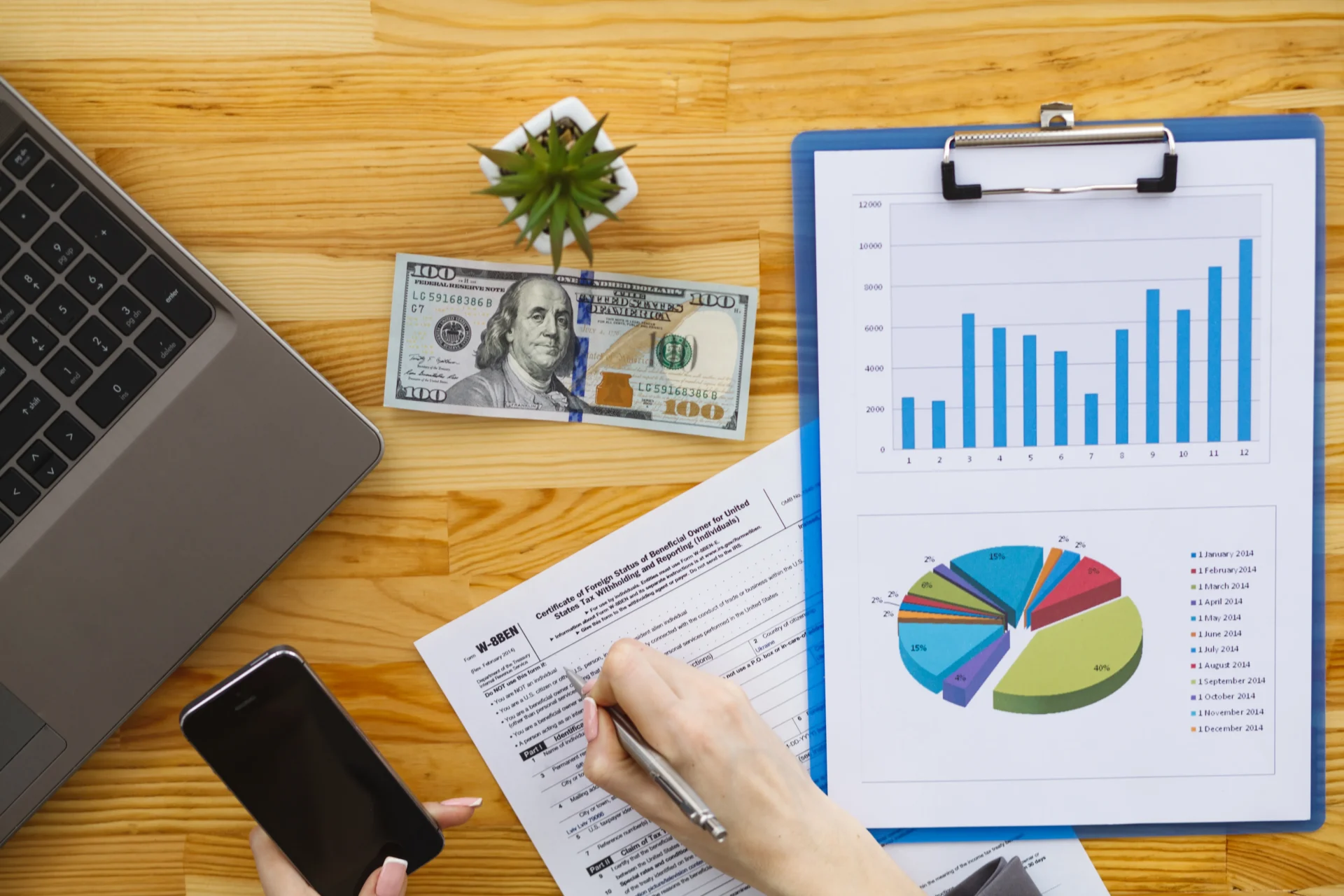 woman-hand-writing-or-signing-in-a-document