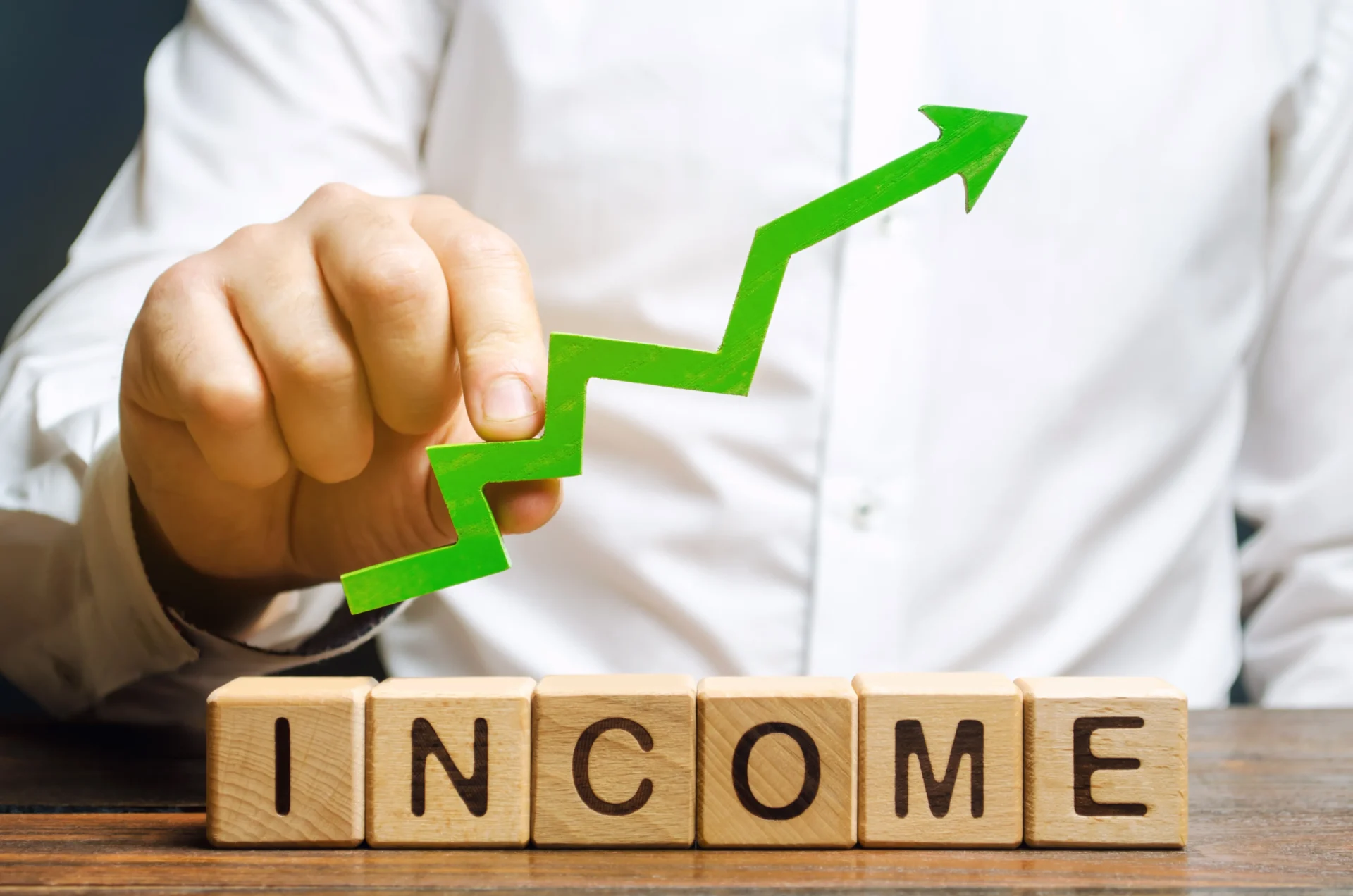 wooden-blocks-with-the-word-income-and-the-up-arrow